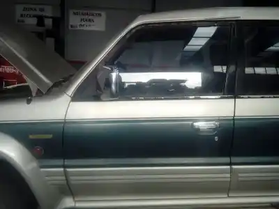 Автозапчасти б/у левая передняя дверь за mitsubishi montero (v20/v40) 2500 td gl ссылки oem iam 