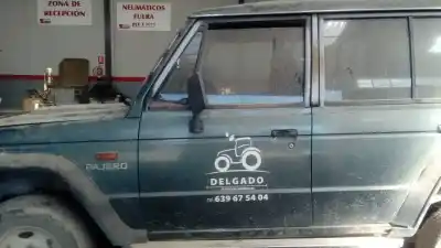 Автозапчасти б/у левая передняя дверь за mitsubishi montero (l040) 2500 td ссылки oem iam 