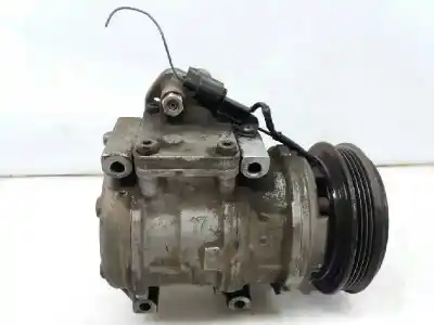 Автозапчастина б/у КОМПРЕСОР КОНДИЦИОНЕРА для KIA CARNIVAL I (UP)  Посилання на OEM IAM 0K56E61450A  