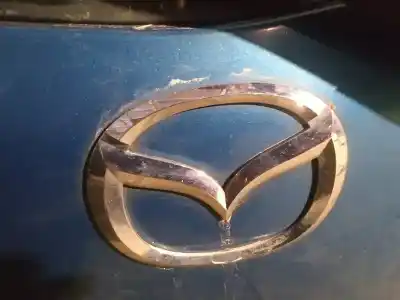 Автозапчастина б/у емблема для mazda 2 lim. (de) 1.3 active + посилання на oem iam 