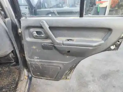 Автозапчасти б/у обивка задней правой двери за mitsubishi montero v20 v40 2800 td glx 5-ptas. ссылки oem iam mb784189